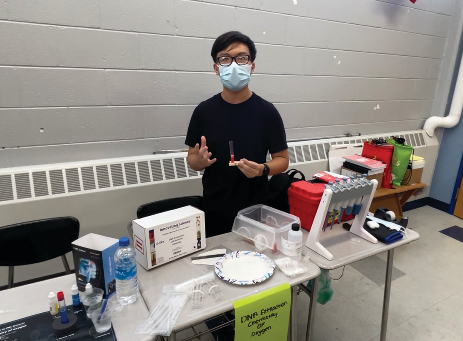 IT’S DNA: Brian Zhu, a sophomore at Cranston High School East, discusses his experiment focused on DNA extraction and the chemistry of oxygen at Park View Middle School last week. Zhu was part of the STEM Advantage summer program, and he and classmate Andy Wu have also worked at Global Science and Envirotech Inc., one of the program’s supporters. Sign